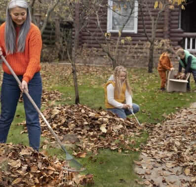 Family cleaning the backyard